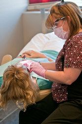 Patient undergoing gum disease treatment