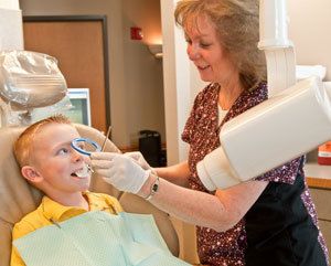 Young boy getting dental x-rays taken